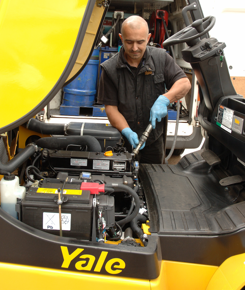 Technician inspects a Yale truck for planned maintenance.