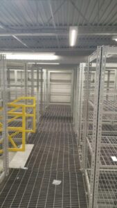 Wire mesh racking in a storage facility.