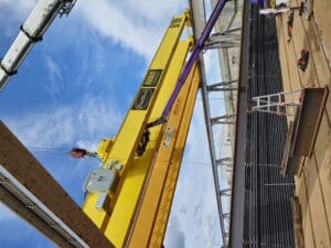 A crane lifting materials at a construction site.
