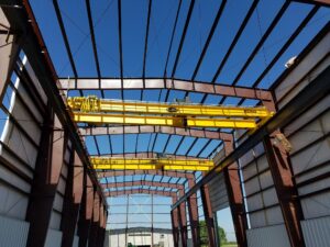 Dual crane systems being added to an industrial warehouse.
