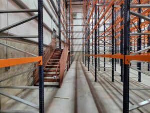 Warehouse with color-coded pallet racking.