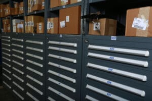 A storage room with drawers and boxes.