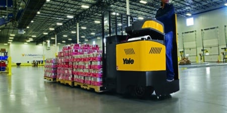 class two lift that is transporting a 3 pallet deep load around warehouse.