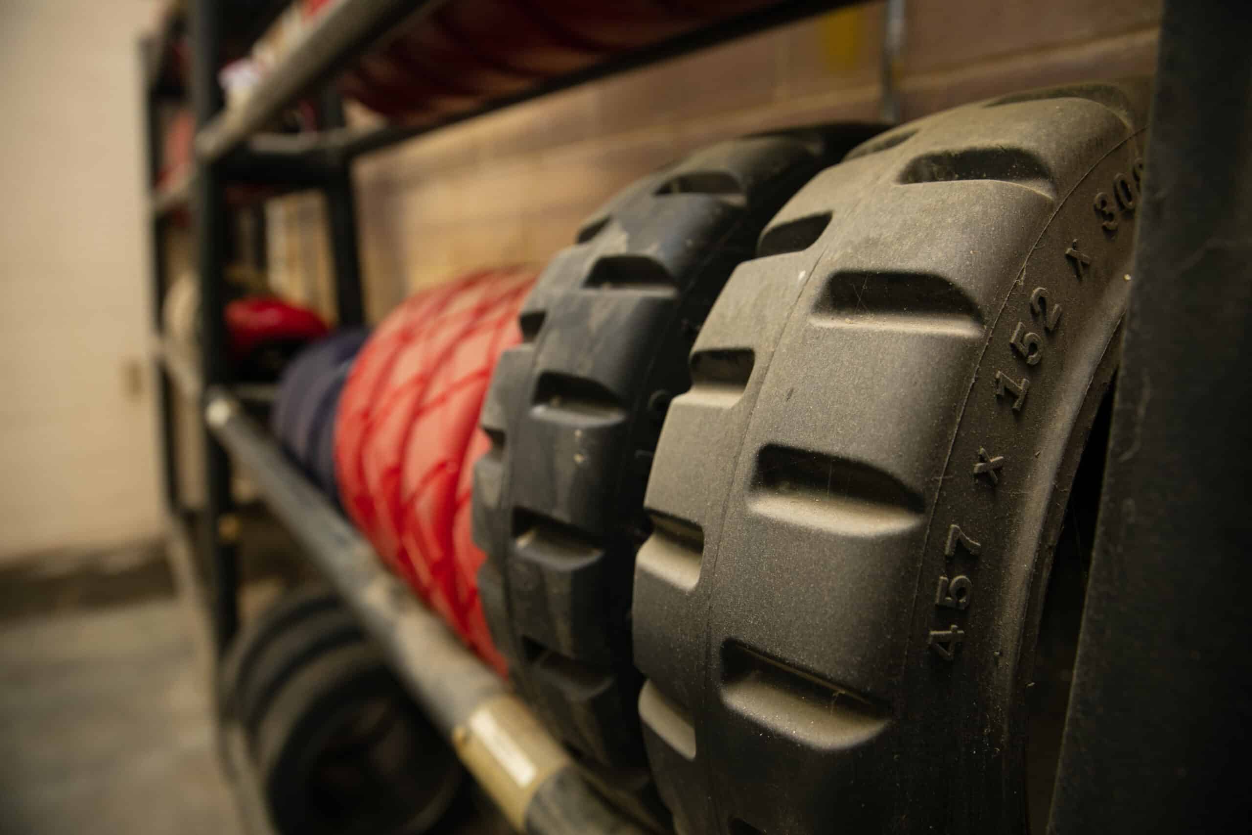 Rack of different styles of forklift tires