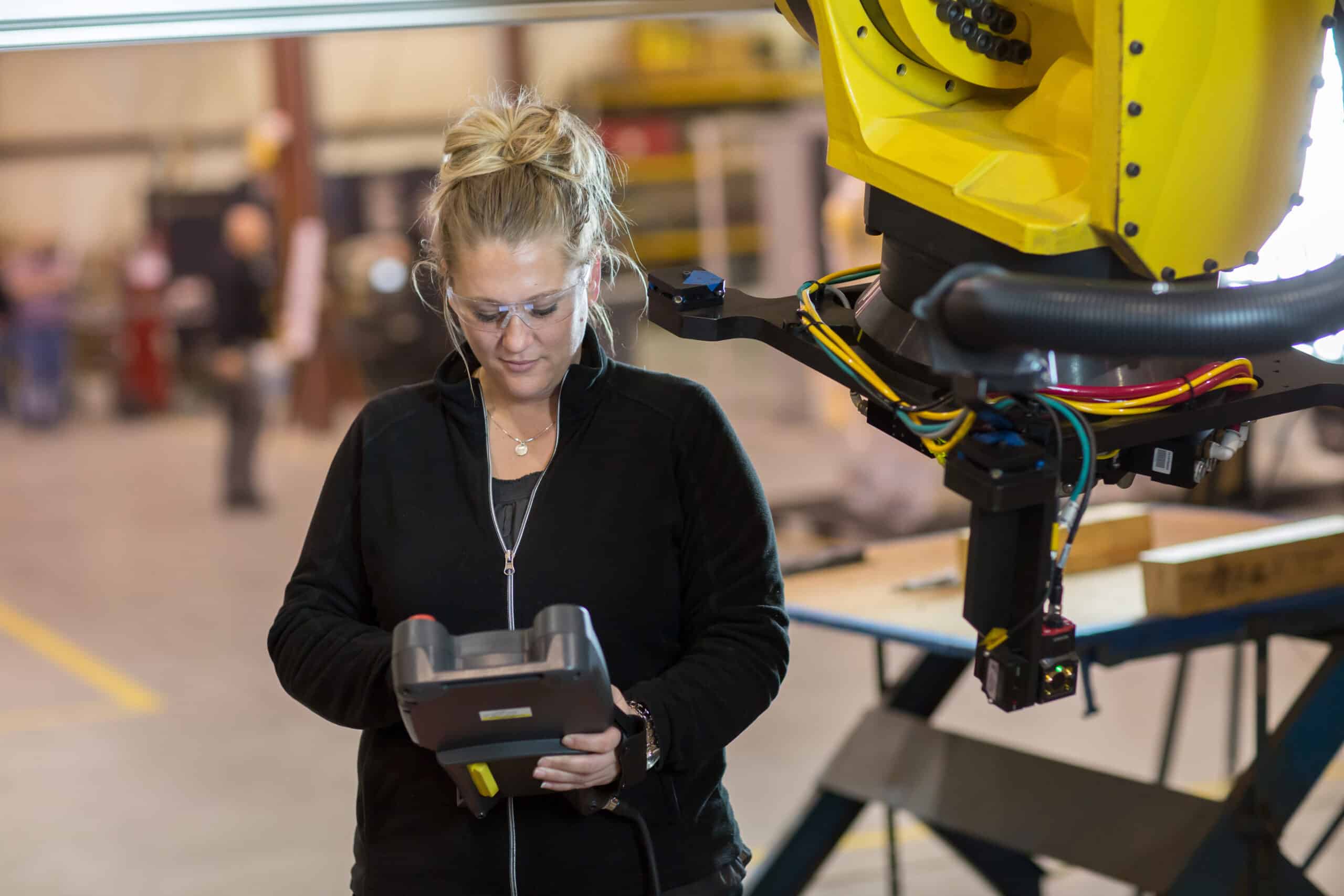 Automation worker using robotic arm