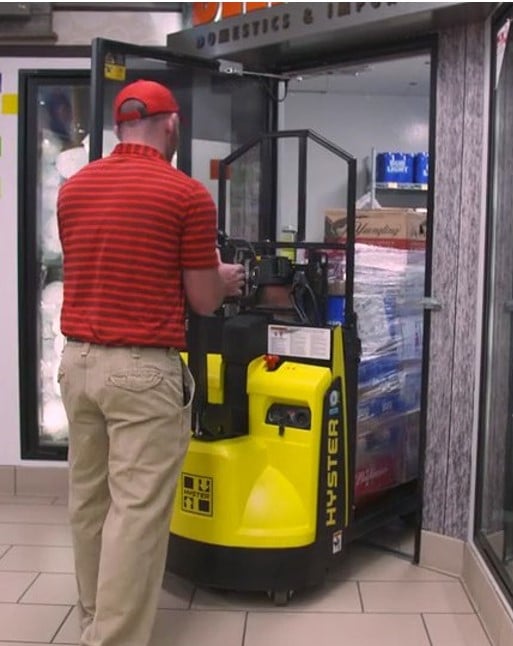 hyster lithium ion walkie pallet jack going into beverage refrigerator