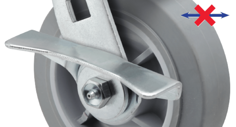 Image of a cam-style brake on a caster that prevents lateral motion by creating a positive locking force against the wheel hub.