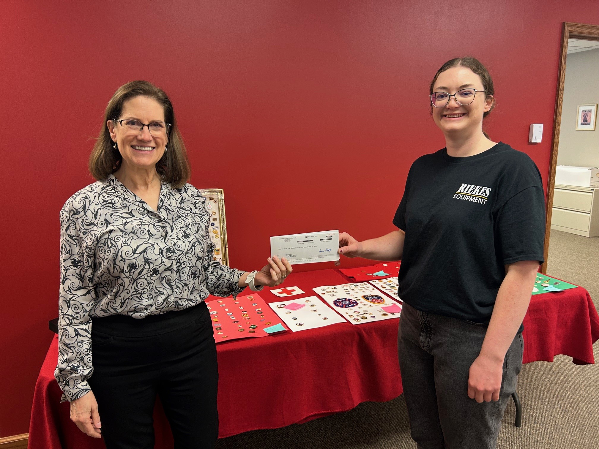 Riekes Equipment donated five dollars for each customer feedback survey received and presented the resulting check to the Red Cross.