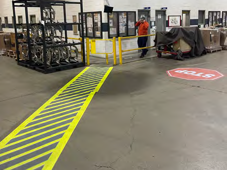 laser lines on a warehouse floor designating pediestrian walkways