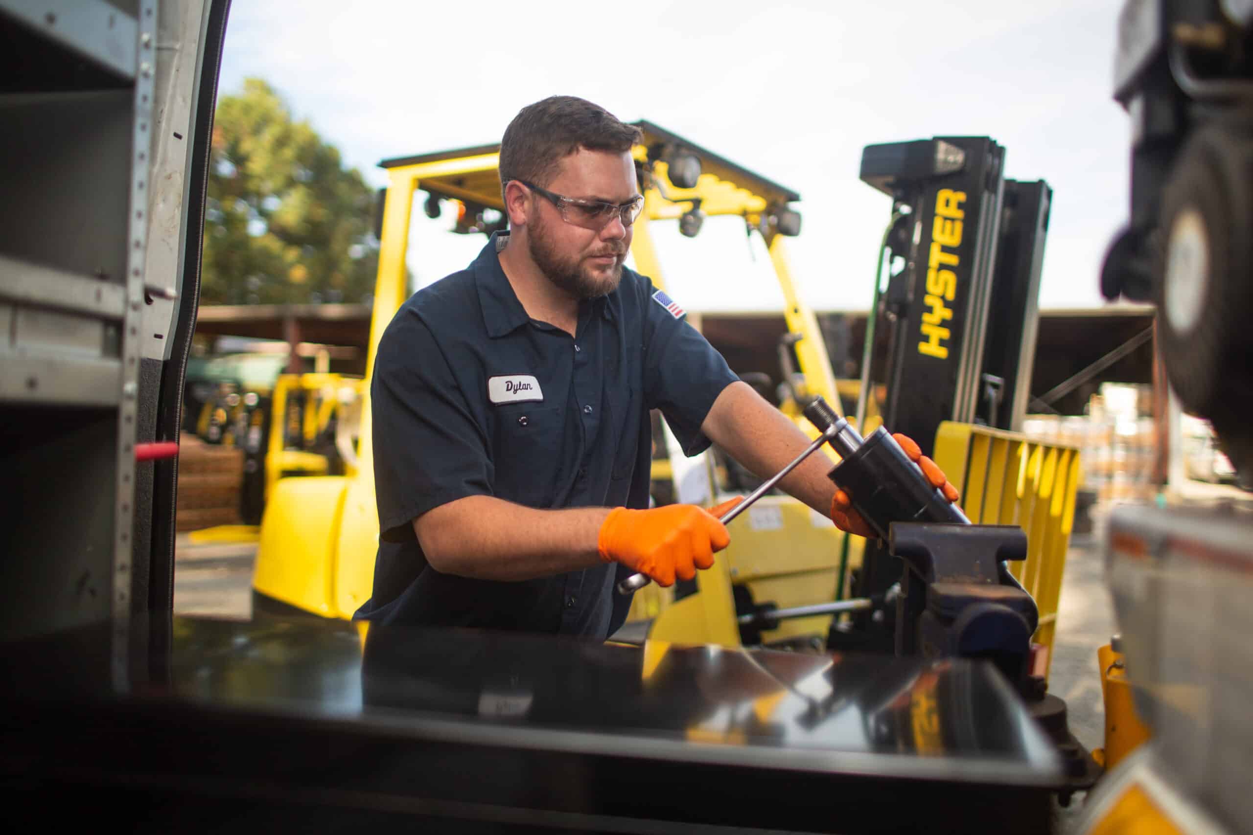 Mechanic works on machine maintenance