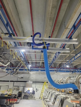 close up image showing the new vacuum lift installed on a crane bridge for a pet food manufacturer.