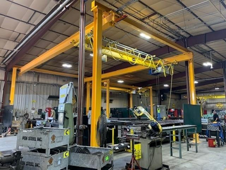 image of an overhead crane system in a warehouse